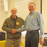 Bruce receives the Rotarian of the Month award from Prez John.