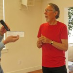 Tom presents a donation check for the Shelter Box program.